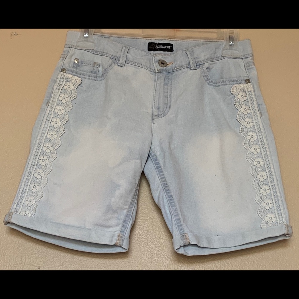 Light denim, long shorts.